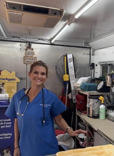 Kellie Lightbourn smiling in a mobile veterinary clinic
